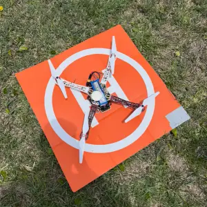 Quadcopter on an orange landing pad