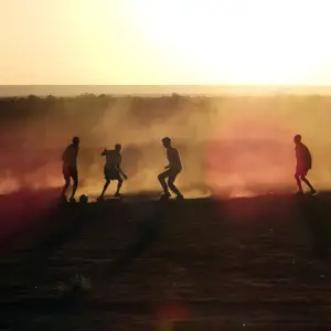 Pickup soccer at sunset