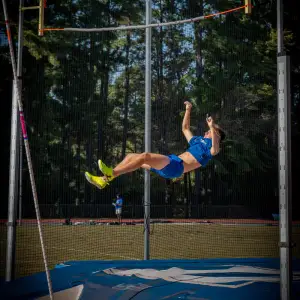Pole vaulter clearing the bar