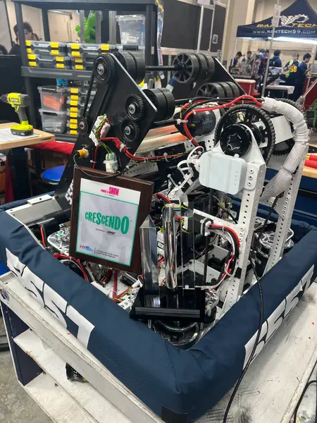 Team 5557 robot in the pits with an award plaque and trophy resting on it