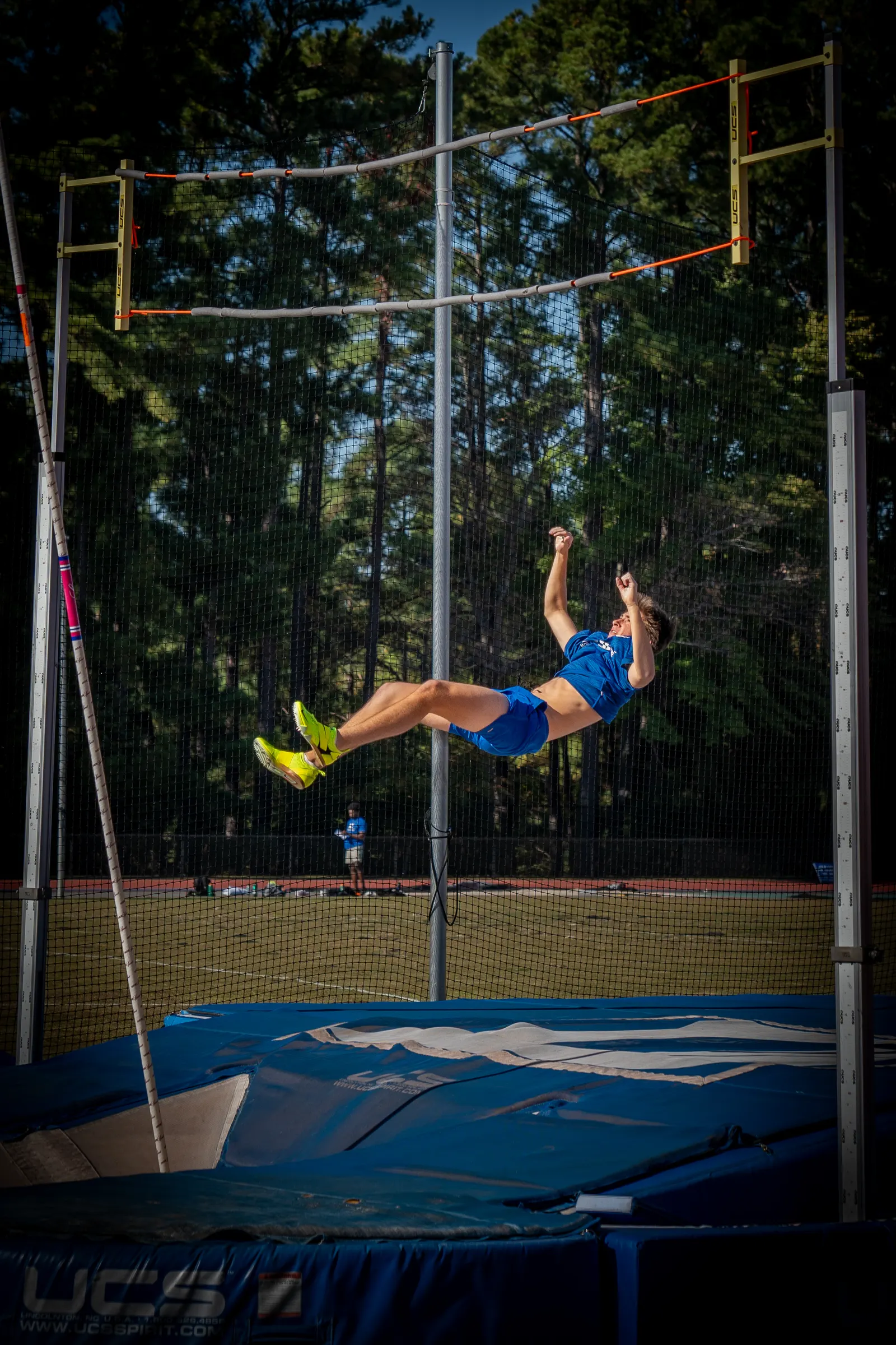 Pole vaulter clearing the bar, body horizontal